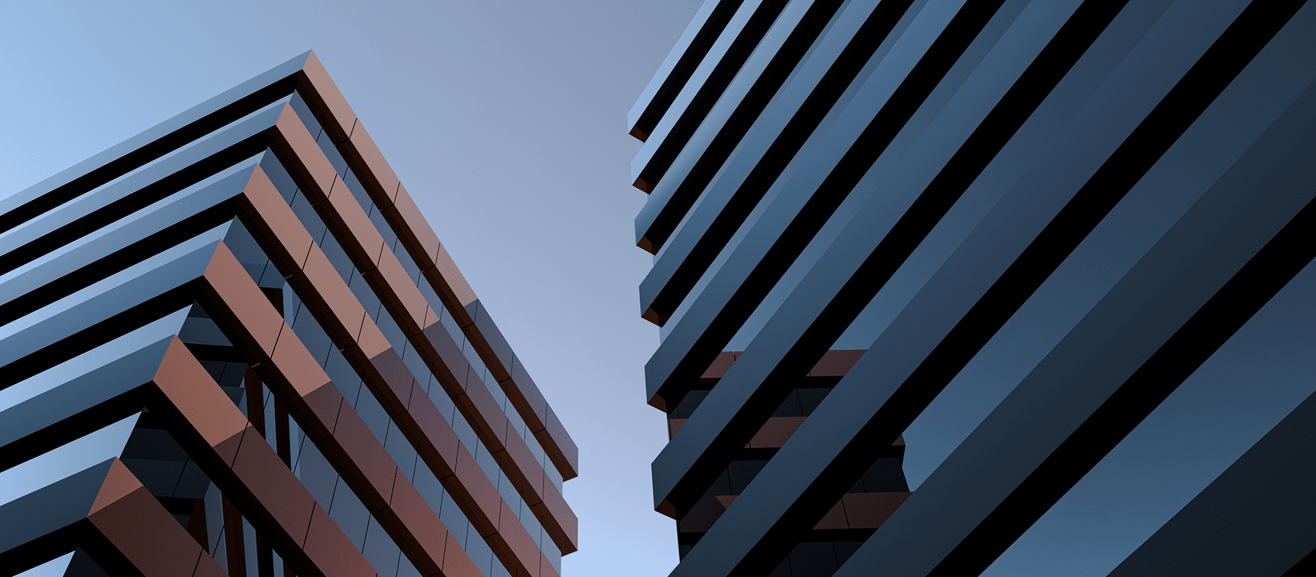 Modern angular buildings against clear blue sky.