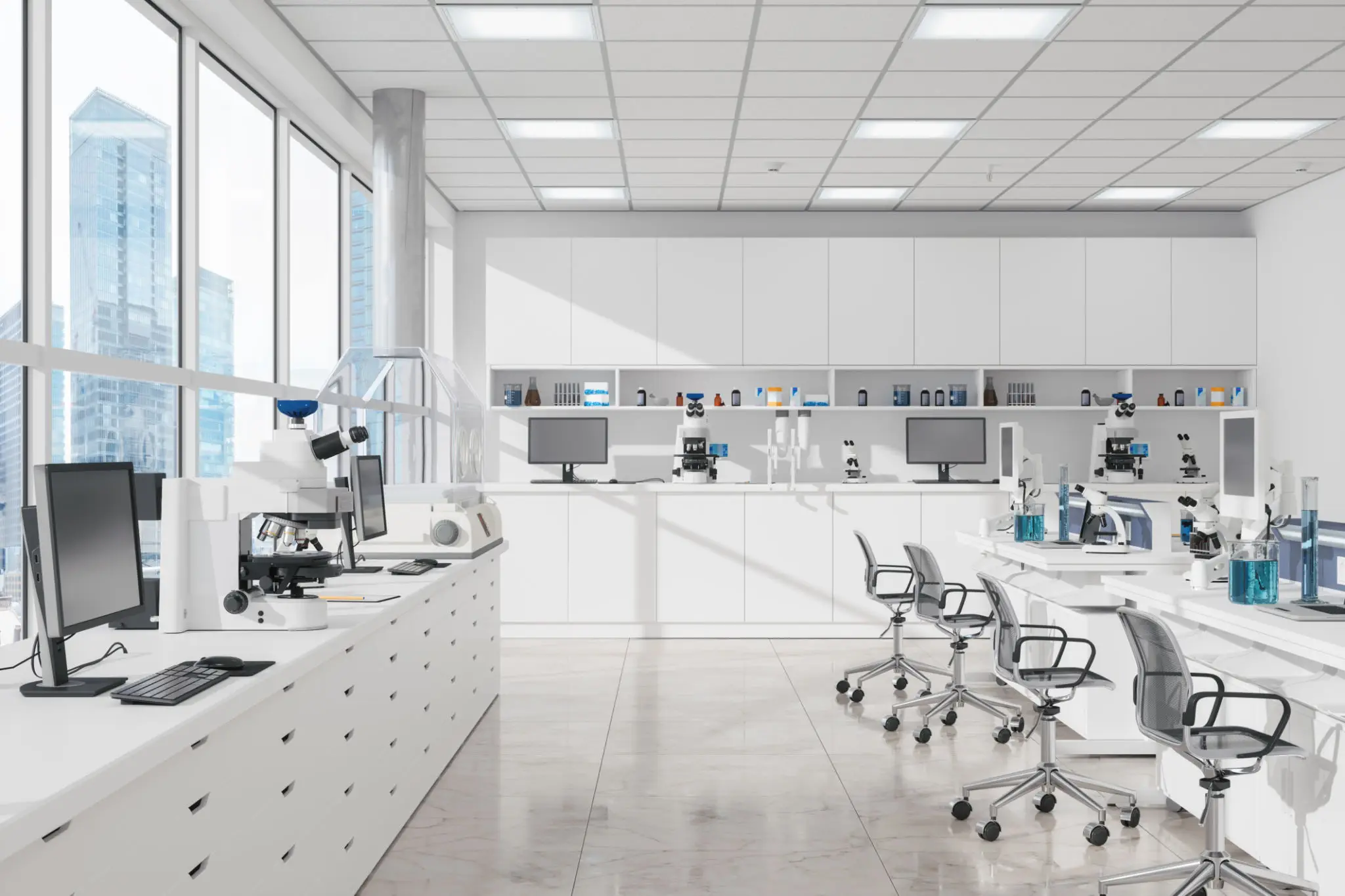 A bright, modern laboratory with white countertops and equipment.