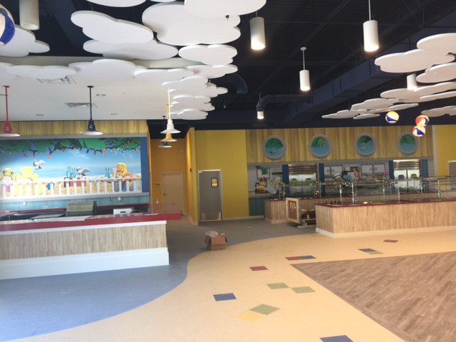 Bright, modern cafeteria with colorful decor and clean design.
