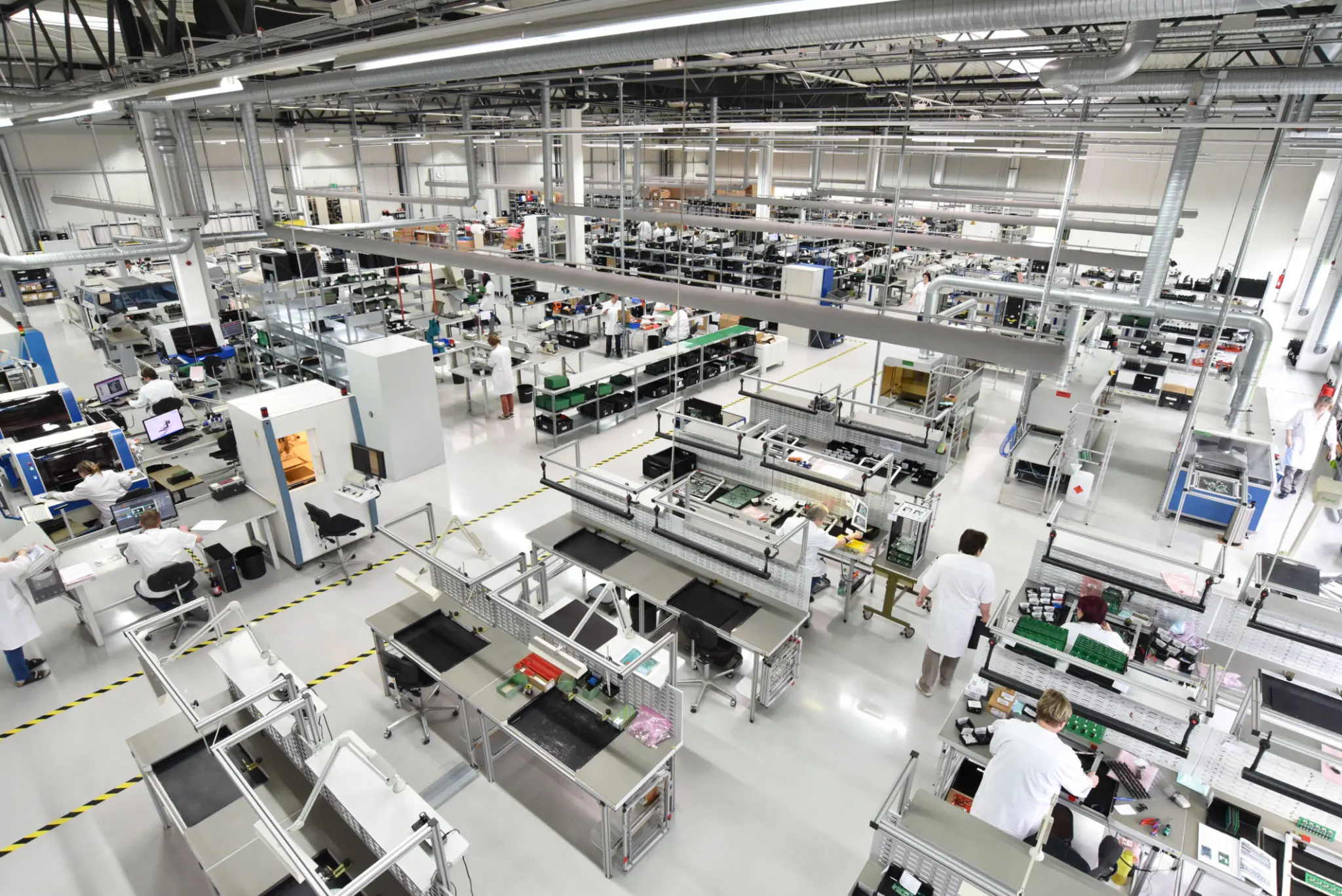 A large, organized electronics manufacturing facility with assembly lines.